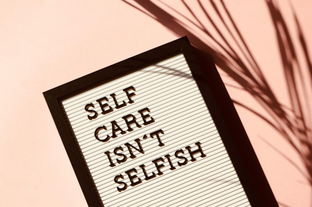 Plaque with "Self care isn't selfish" written on it