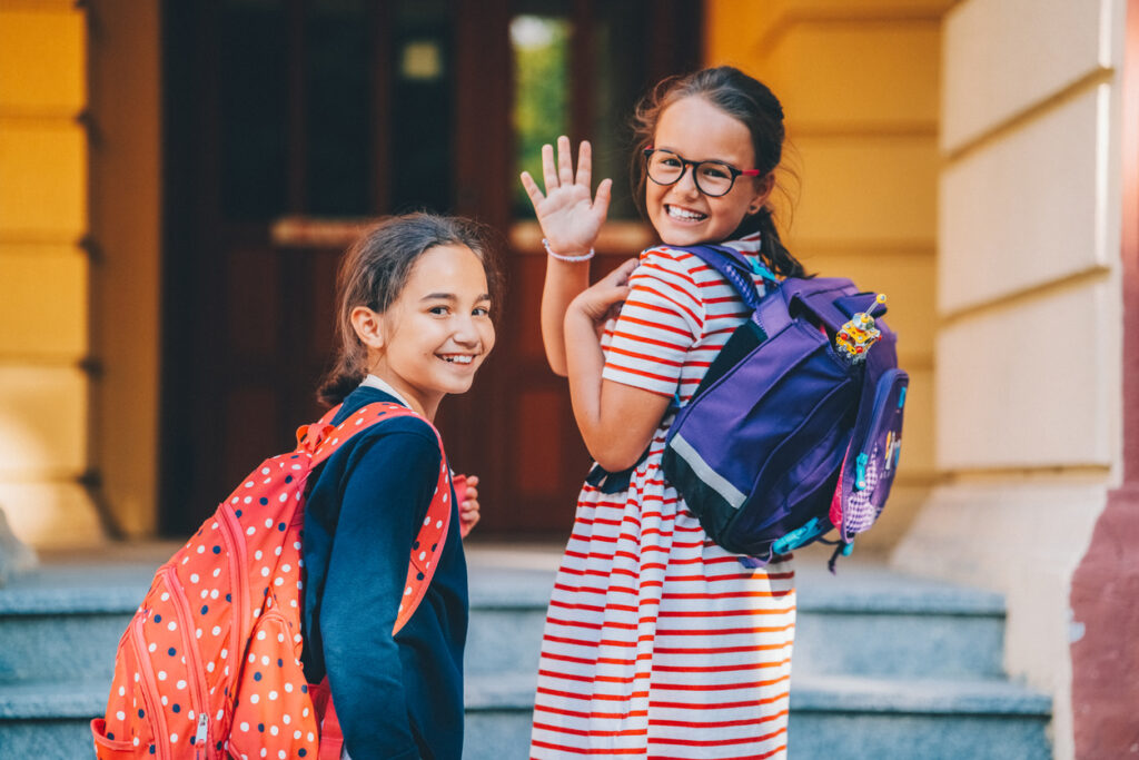 Two girls with backpacks